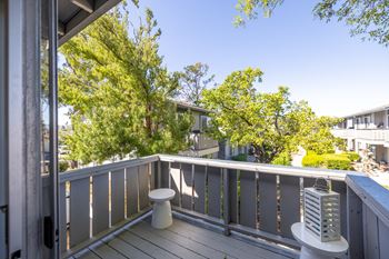 A view of a balcony with a toilet and a radiator on it